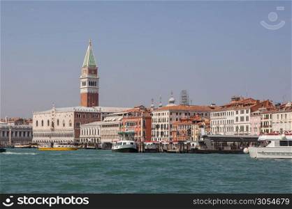 Campanila bell tower at piazza San Marco from other side of channel in Venice, Italy.. Venice canal scene in Italy