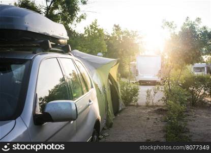 Camper in campsite at the morning sunrise