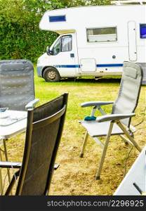 Camper rv camping on campground. Holiday at campsite. Caravan car vacation.. Caravan on camping area