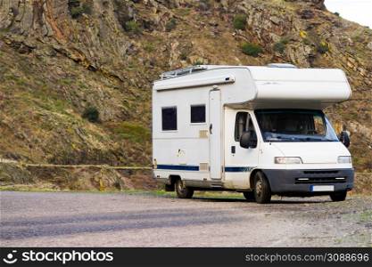 Camper rv camping on nature. Holidays and traveling with motor home.. Camper rv camping on mountain nature