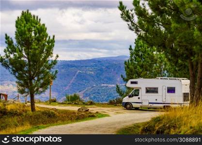 Camper rv camping on nature. Spain. Adventure with motor home.. Rv camper camping on nature