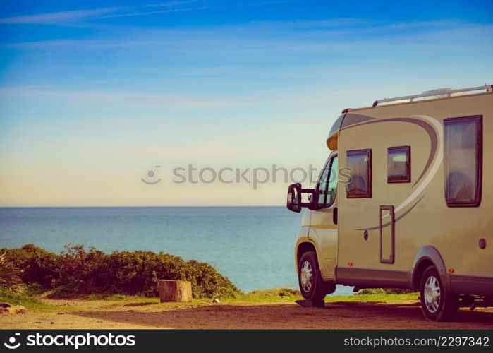 Camper rv caravan on mediterranean coast in Spain. Wild camping on nature beach. Holidays and traveling in motor home.. Rv caravan camping on beach