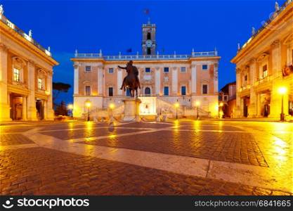 Campidoglio square on Capitoline Hill, Rome, Italy. Piazza del Campidoglio on the top of Capitoline Hill with the facade of Senatorial Palace and equestrian statue of Marcus Aurelius at night, Rome, Italy