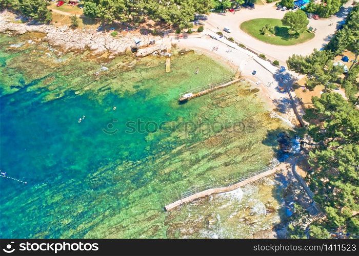 Camping by the sea and crystal clear stone beach aerial view in Savudrija, Istria region of Croatia