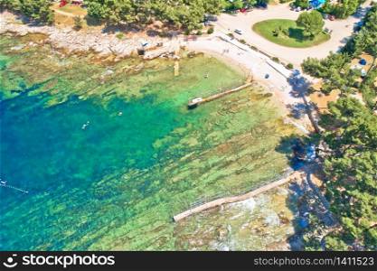 Camping by the sea and crystal clear stone beach aerial view in Savudrija, Istria region of Croatia