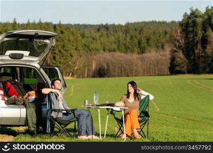 Camping car happy young couple enjoy picnic sunny countryside