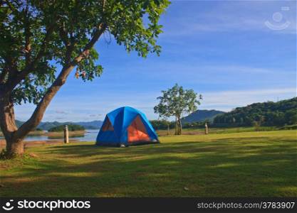 Camping in the wilderness, tent on campground in morning