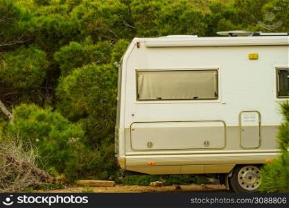 Camping on mediterranean coast in Spain. Camper vehicle on beach, sea shore.. Camper rv camping on coast