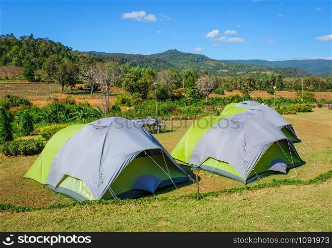 Camping tent tourist on hill mountains background