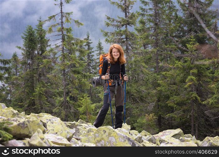 camping trip. girl hiker with a map at the Carpathians mountains. gorgany, Ukraine.