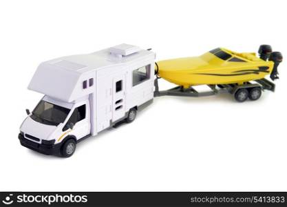 Camping vehicle pulling speed boat on trailer