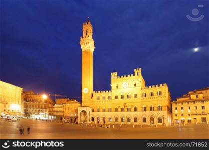 Campo Square and Mangia Tower in Siena at night, Italy