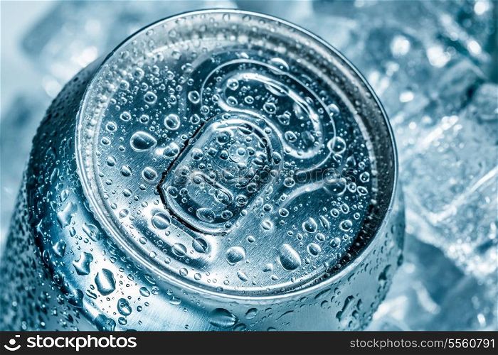 Can of soft drink on ice.