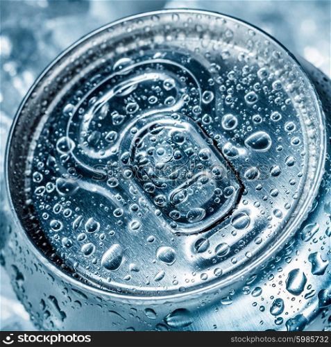 Can of soft drink on ice.
