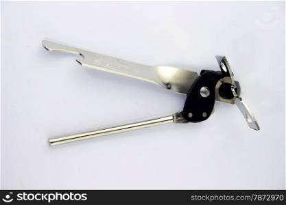 can opener . A can opener isolated against a white background