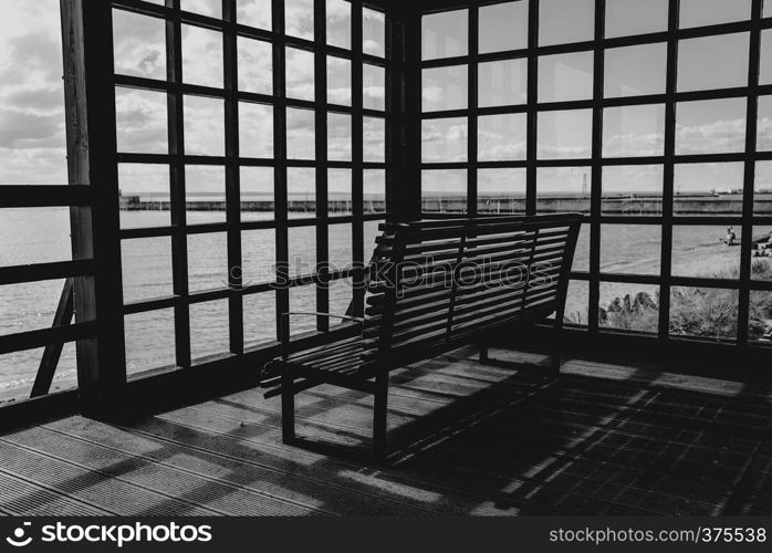 Can take relax on the wooden bench with view of sea in black and white concept