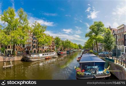 Canal and bridge in Amsterdam. Amsterdam is the capital of the Netherlands in a summer day