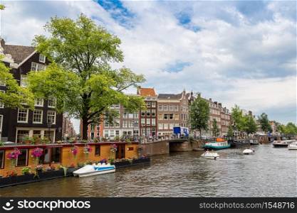 Canal and bridge in Amsterdam. Amsterdam is the capital of the Netherlands in a summer day