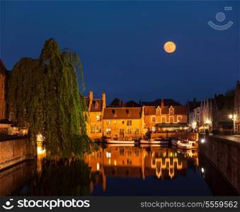 Canal and medieval houses in twilight. Bruges (Brugge), Belgium