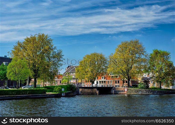 Canal and Spaarne river and houses in Haarlem, Netherlands. Canal in Haarlem, Netherlands