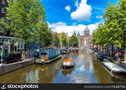 Canal and St. Nicolas Church in Amsterdam. Amsterdam is the capital and most populous city of the Netherlands