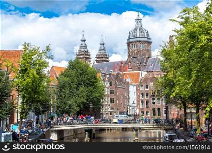 Canal and St. Nicolas Church in Amsterdam. Amsterdam is the capital and most populous city of the Netherlands