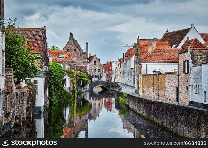 Canal, bridge and medieval houses in Bruges  Brugge , Belgium. Houses in Bruges Brugge, Belgium