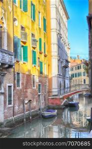 canal in Venice, Italy, with boats in the foreground