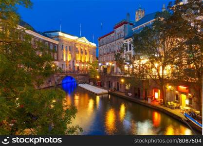 Canal Oudegracht and bridge in the colorful illuminations at night, Utrecht, Netherlands