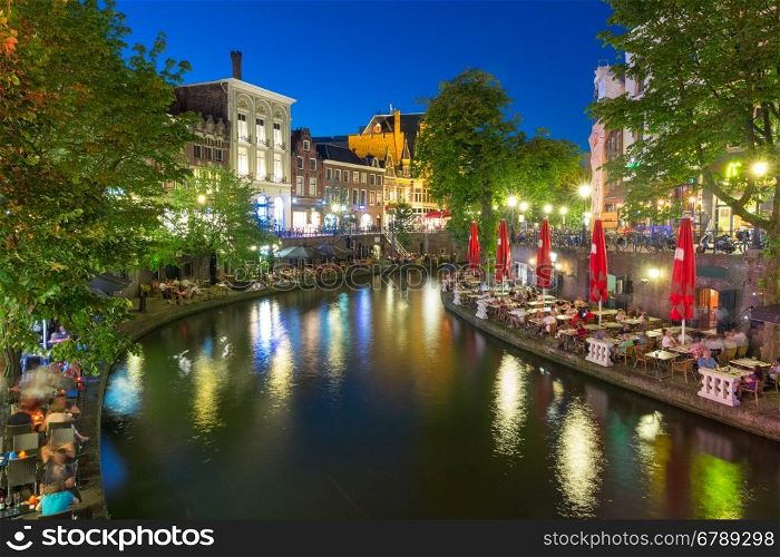 Canal Oudegracht in the colorful illuminations at night, Utrecht, Netherlands