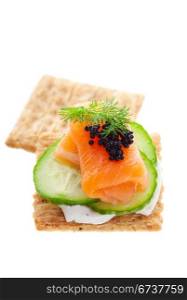 Canape with salmon, cream cheese and caviar, shallow depth of field