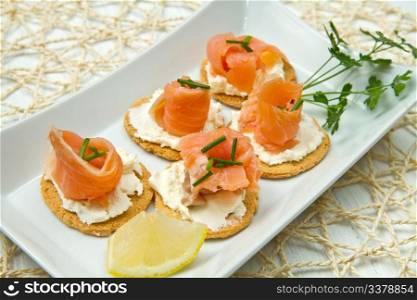 Canape with Salmon on white dish