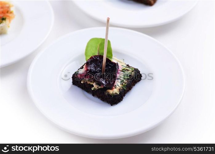Canapes with marinated beetroot and cream cheese