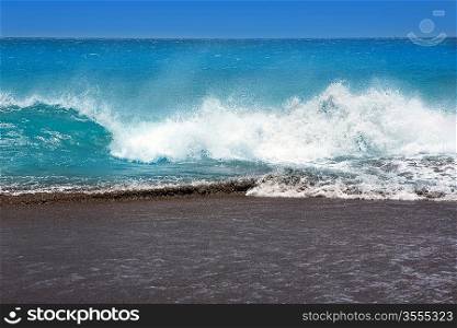 Canary Islands brown sand beach and tropical rough turquoise waves