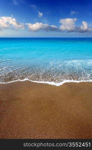 Canary Islands brown sand beach and tropical turquoise water