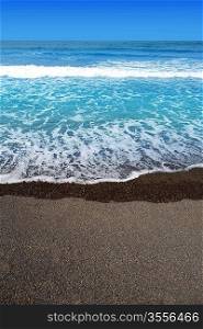 Canary Islands brown sand beach and tropical turquoise water