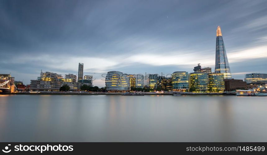 Canary Wharf harbour at blue hour after sunset in London