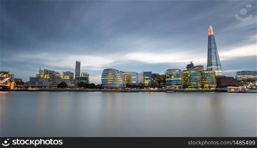 Canary Wharf harbour at blue hour after sunset in London