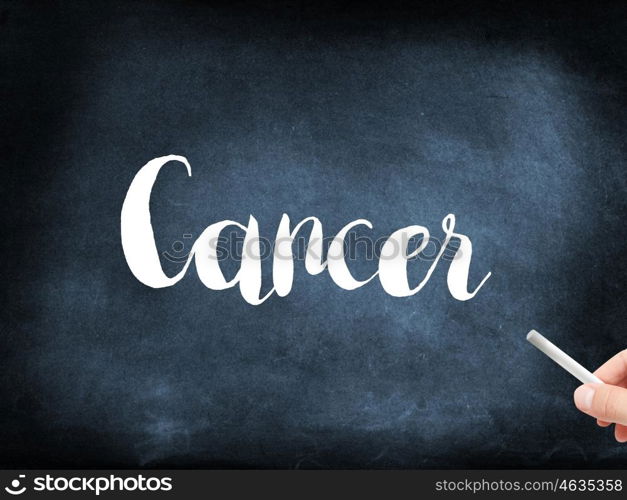 Cancer written on a blackboard