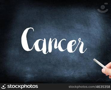 Cancer written on a blackboard