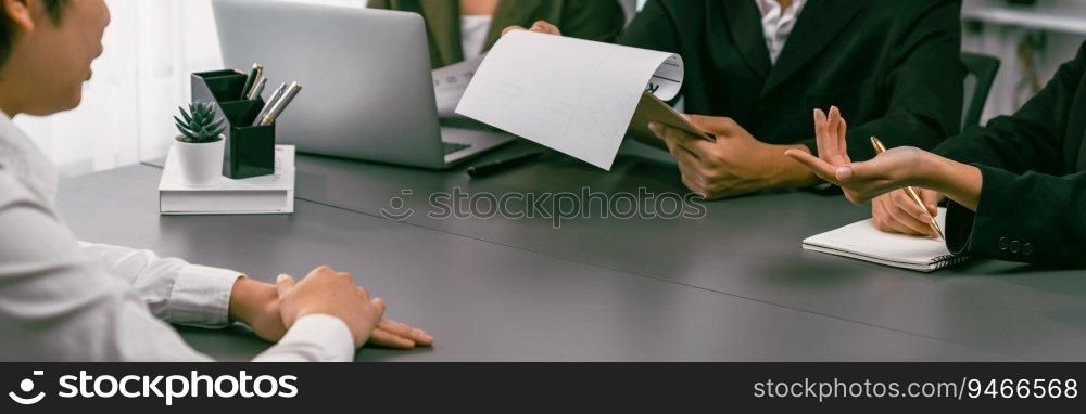 Candidate and interviewers discuss work experience and qualifications in friendly job interview at corporate office. HR team evaluates job application while interviewee explaining profile. Prodigy. Candidate and interviewers discuss work experience in job interview. Prodigy