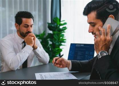 Candidate feeling dissatisfied and lose confidence during job interview as interviewer talk on the phone, ignoring and showing disinterest. Negative interview experience for applicant. Fervent. Candidate feeling dissatisfied and lose confidence during job interview. Fervent