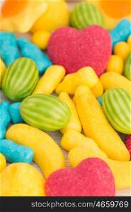 Candies with different shapes and colors close up
