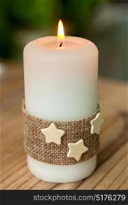 Candle for Christmas at home. Beautiful Holidays decoration