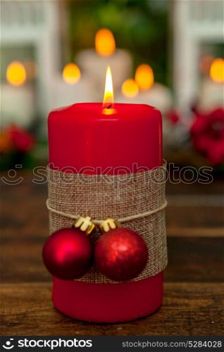 Candle for Christmas in red. Beautiful Holidays decoration