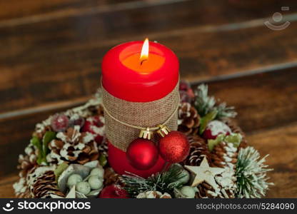 Candle for Christmas in red. Beautiful Holidays decoration