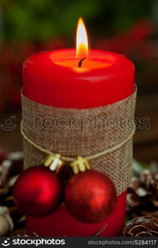 Candle for Christmas in red. Beautiful Holidays decoration