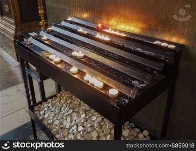 Candle in a church. Candles lit by worshippers in a Christian church