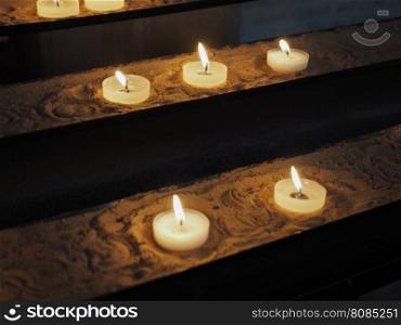 Candle in a church. Candles lit by worshippers in a Christian church