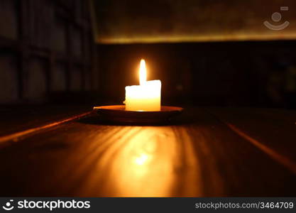 candle in dark room close up